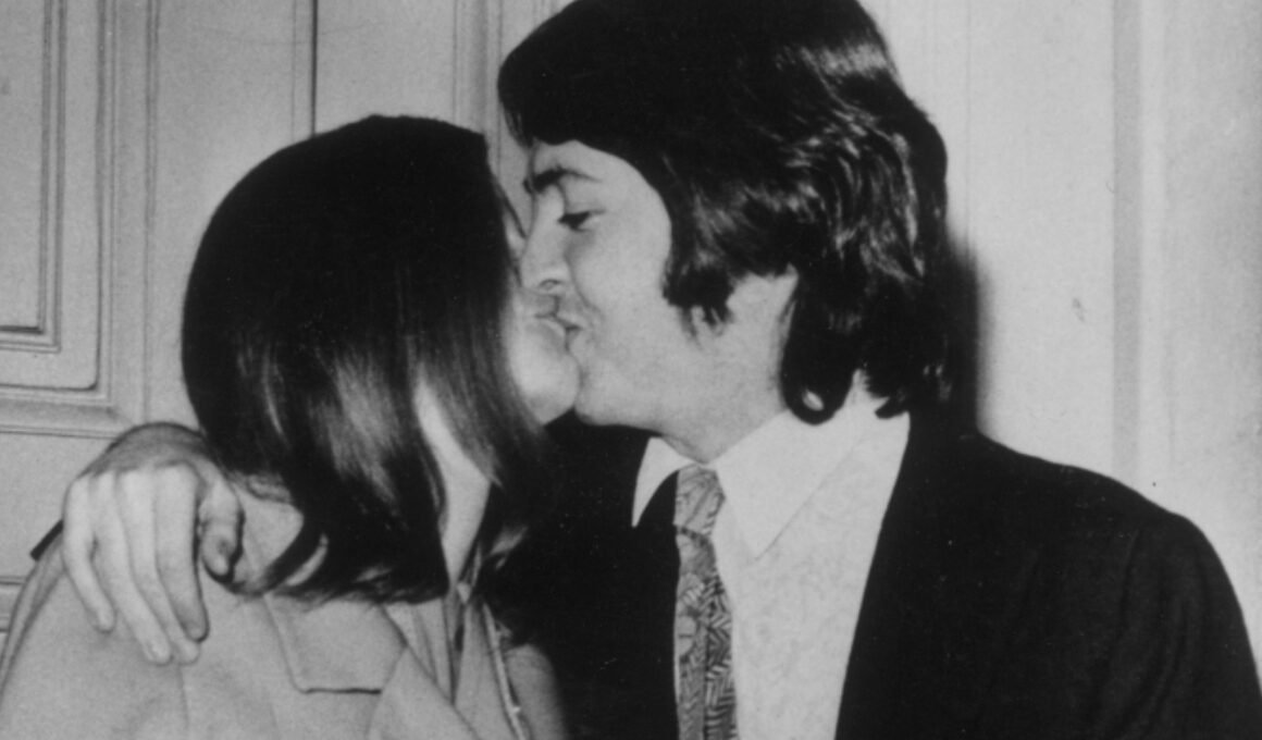 A gray morning, a quiet vow On a gray London morning in 1969, as headlines swirled with speculation about the future of The Beatles, Paul McCartney chose a different story. Hand in hand with Linda Eastman, he walked not into an arena or studio, but toward a modest registry office. There were no dazzling lights, no stadium cheers — just the hush of rain-soaked streets and the certainty of two people choosing love over spectacle. For McCartney, the decision was as bold as any chord he’d ever struck: a step away from the frenzy of Beatlemania, into something far more personal. 1969, Paul McCartney married Linda Eastman at Marylebone Register Office. They then held a reception lunch at The Ritz Hotel, Paul then went to Abbey Road studios in the evening to work. A ceremony shielded by love Inside, the atmosphere was stripped of grandeur. A handful of close friends and family pressed close, forming a protective circle around the couple as if guarding a secret. There were no sweeping gowns or gilded carriages, only the quiet solemnity of vows spoken from the heart. Outside, in the drizzle, fans gathered in throngs, some sobbing, some cheering, their voices carrying through the damp air. The rain could not dampen their devotion; when the doors finally opened, it seemed the entire street exhaled at once. The Day Paul McCartney Married Linda Eastman A love story steps into view The turbulent years of Paul and Linda McCartney: Why the perfect marriage of pop was never so | Culture | EL PAÍS English The newlyweds appeared, hand in hand, Linda radiant in her simplicity, clutching a modest bouquet, Paul smiling with a tenderness that even the sharpest camera lens could barely capture. His boyish grin softened by the weight of fame, her quiet glow undimmed by the flashing bulbs — together they looked less like rock ’n’ roll royalty and more like two people in love, carving out a space for themselves in a world that demanded constant spectacle. Whispers spread among onlookers that this was no ordinary marriage; it was the beginning of a different kind of revolution, one not broadcast on record players but written in the private language of devotion. A revolution of the heart 12 March 1969: Paul McCartney marries Linda Eastman | The Beatles Bible When they drove away in an ordinary car, leaving the umbrellas and flashbulbs behind, the moment became history. It was proof that love, in its most unguarded form, can outshine the noise of an era. For fans, it was bittersweet — the end of one chapter in the Beatles’ myth and the beginning of another story, quieter but no less powerful. For Paul and Linda, it was the start of a partnership that would stand as a testament to resilience and tenderness. On that gray London morning, the world witnessed not just a wedding, but the opening chords of a love story destined to endure far longer than gossip ever could. paul-and-linda